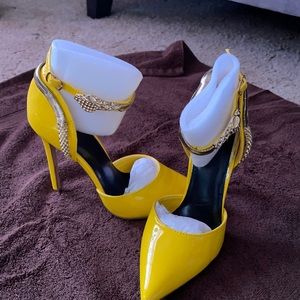 Neon yellow colored high heels. Been worn once. Still in box.